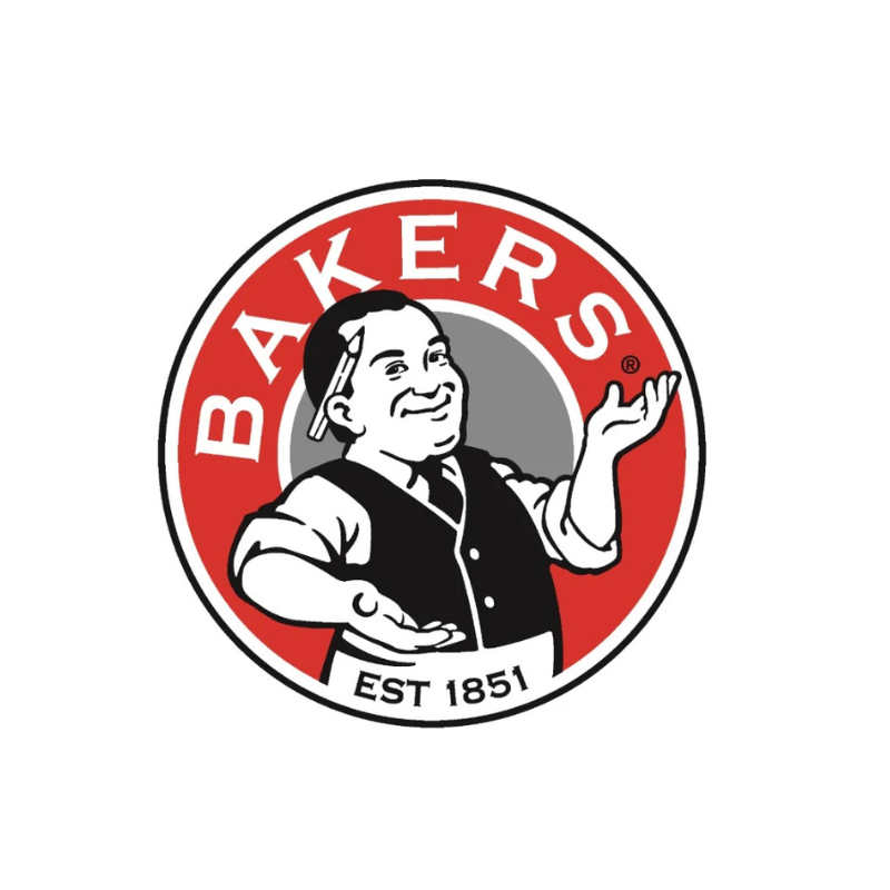 A circular red, white, and black Bakers logo featuring a smiling cartoon baker with one hand raised and the text 'BAKERS' and 'EST 1851'.